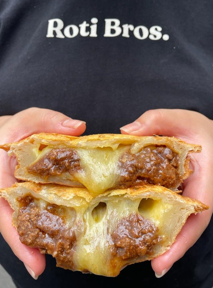 Roti Bros | Pies made with a flaky roti pastry.